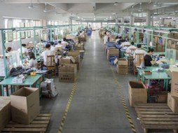 Workers manufacturing premium aquarium solutions at the A&Aqua Pro factory