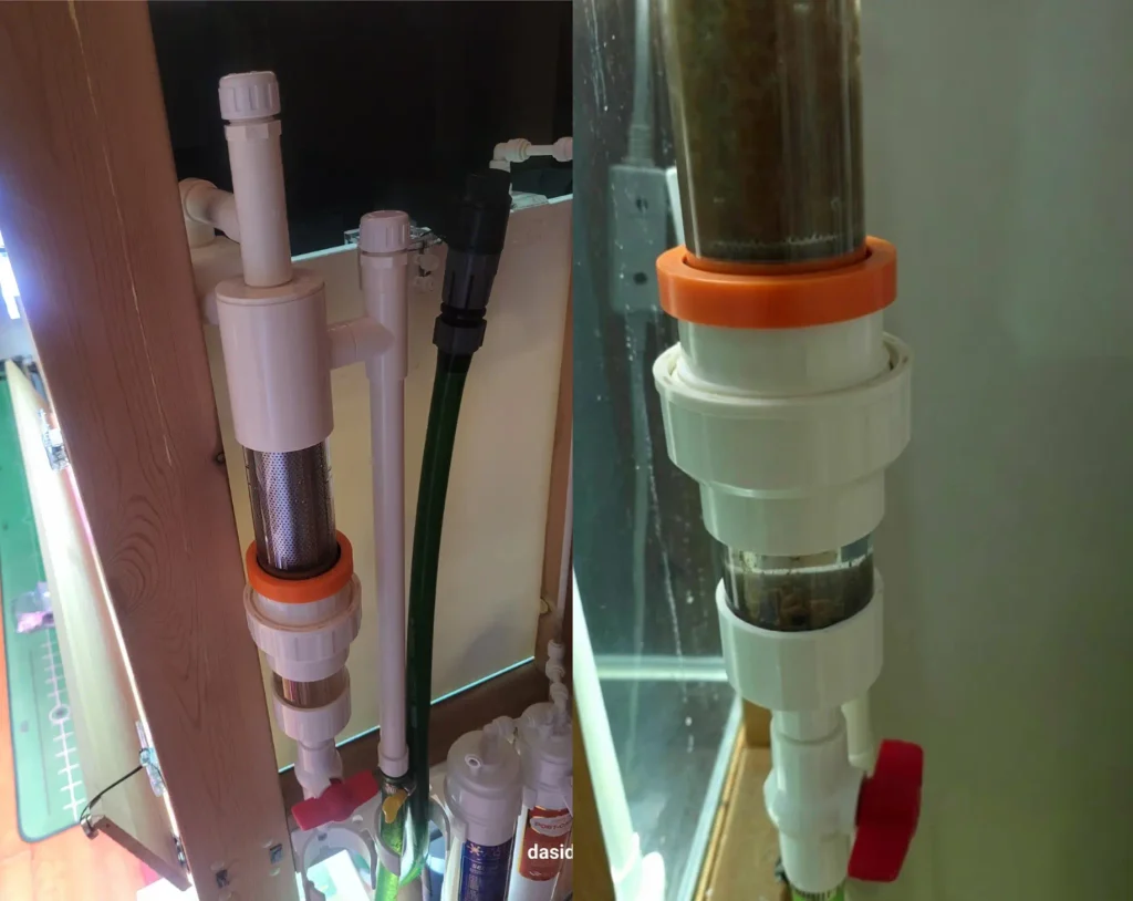 Fish toilet filter installed on a planted pleco tank with visible waste collected in the clear chamber